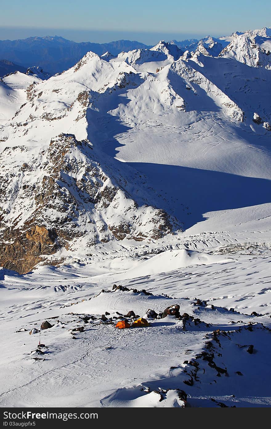 Tourists camp on a mountain Elbrus slope. The Caucasian mountains, Russia. Tourists camp on a mountain Elbrus slope. The Caucasian mountains, Russia