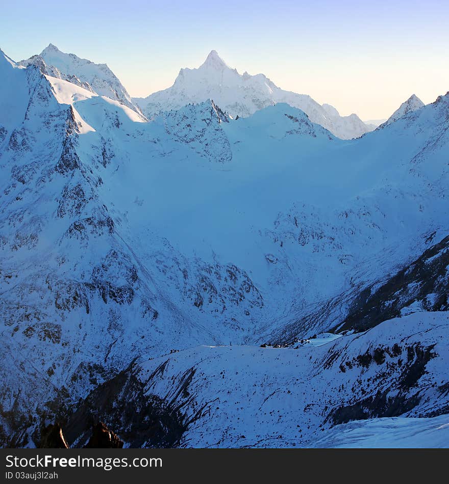 Sundown in snowy mountains Elbrus, adobe Azay district, Northern Caucasus