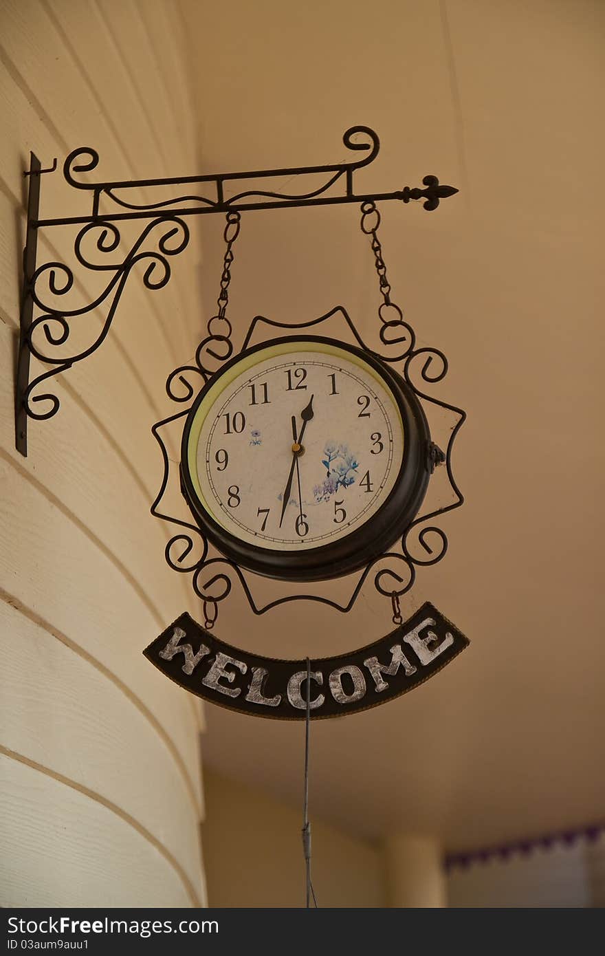 Old clock is hanging on the wall