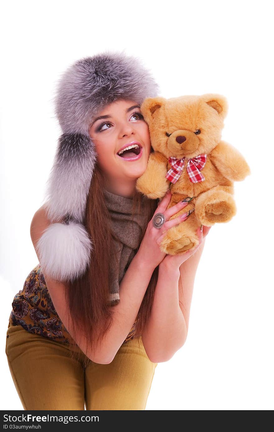 Beautiful longhair girl is holding the teddy bear. Beautiful longhair girl is holding the teddy bear