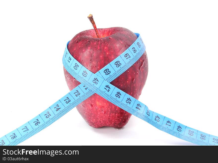 Red apples bind with a tape measure. Red apples bind with a tape measure.