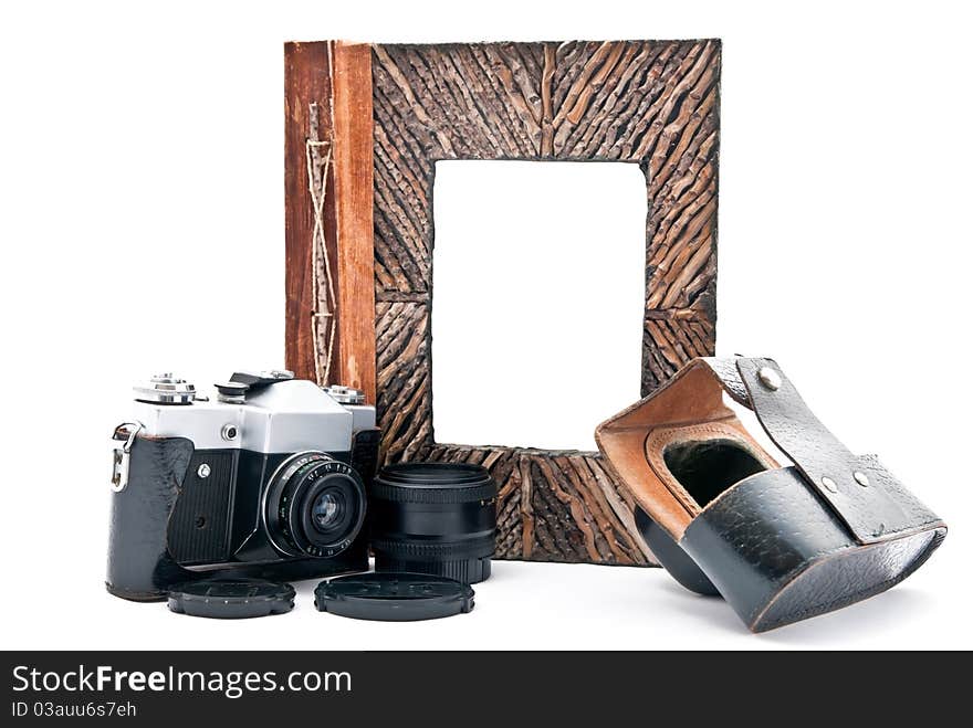 Vintage camera and photo album with empty picture. Isolated on white. Focus on camera. Vintage camera and photo album with empty picture. Isolated on white. Focus on camera