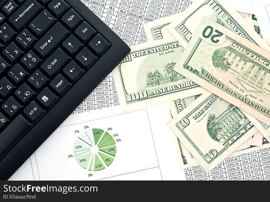 Black keyboard, mouse and dollars on a stock chart. Black keyboard, mouse and dollars on a stock chart