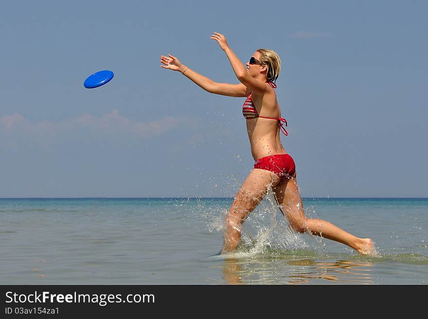 Girl in sea with flying saucer