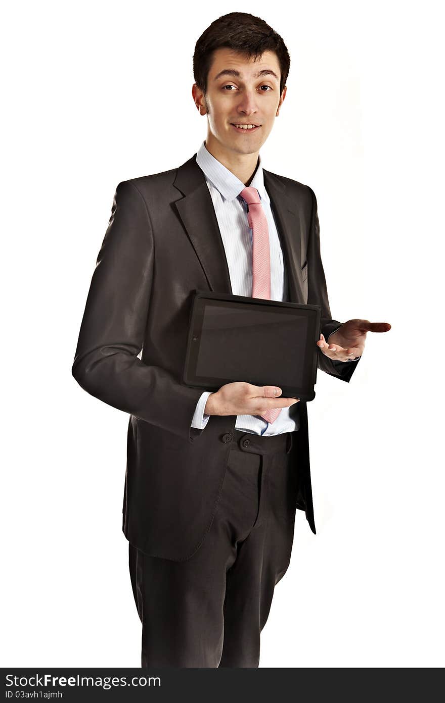 Handsome young man giving a presentation and presenting either his computer tablet, or information on its screen. Handsome young man giving a presentation and presenting either his computer tablet, or information on its screen