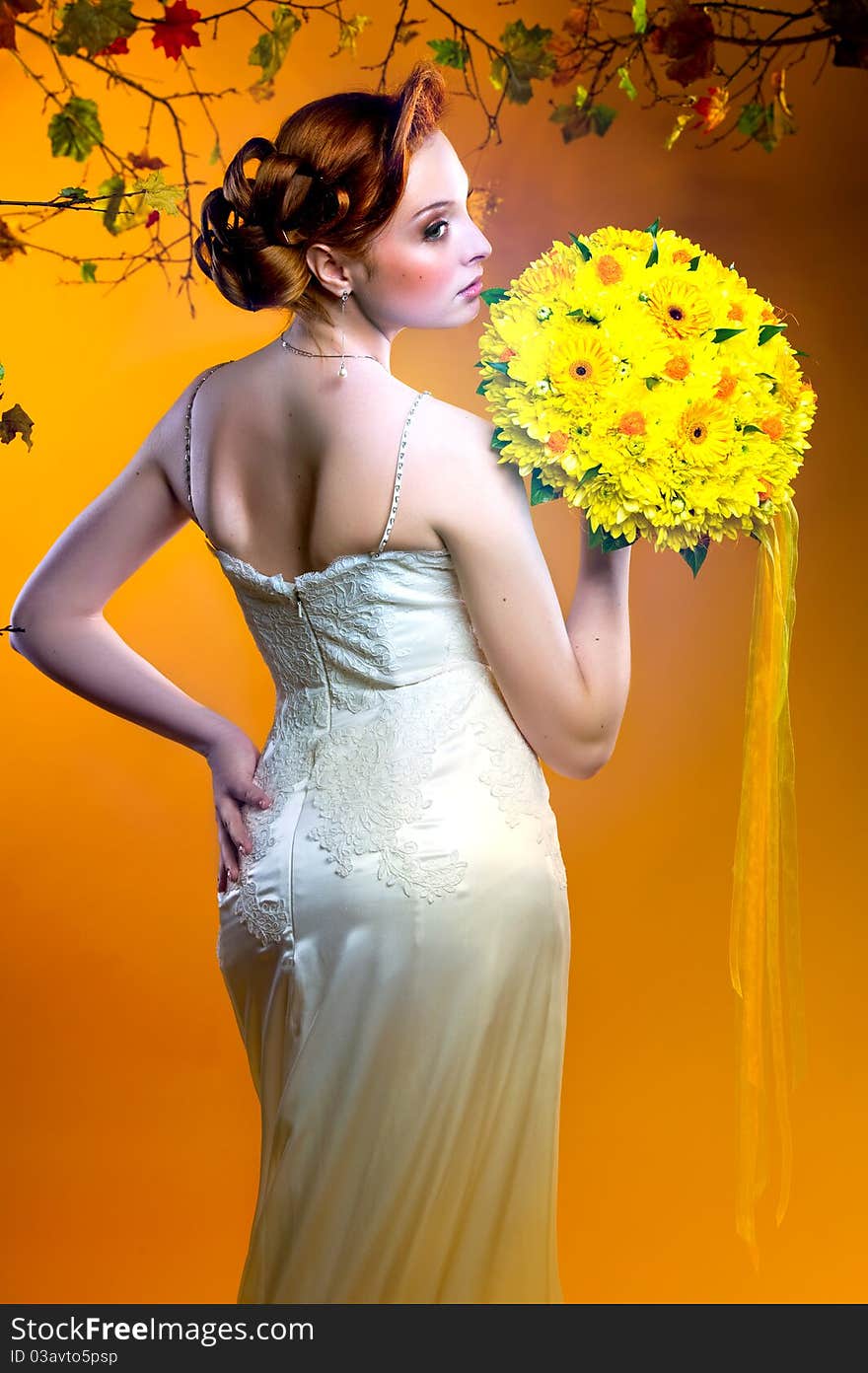 Gorgeous young redhead bride with bouquet of flowers. Gorgeous young redhead bride with bouquet of flowers