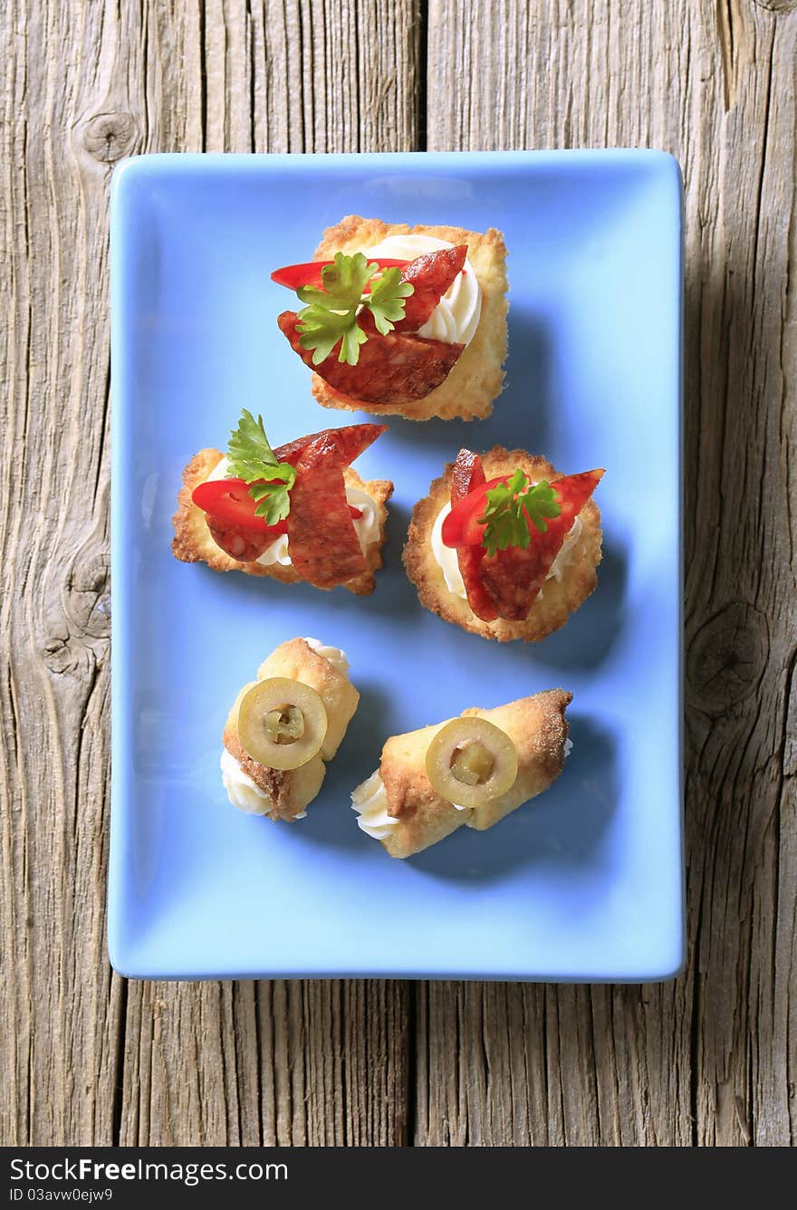 Variety of canapes on a porcelain plate