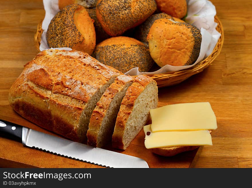 Fresh bread, bread rolls and cheese