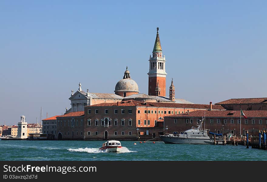 Builidings from San Giogio Maggiore island in Venice Italy, as they can be seen from Tronchetto-Lido di Venezia waterway.In the first plane is the Benedictine San Giorgio Monastery and in the second plane is the Church of San Giorgio Maggiore, designed by the Andrea Palladio.