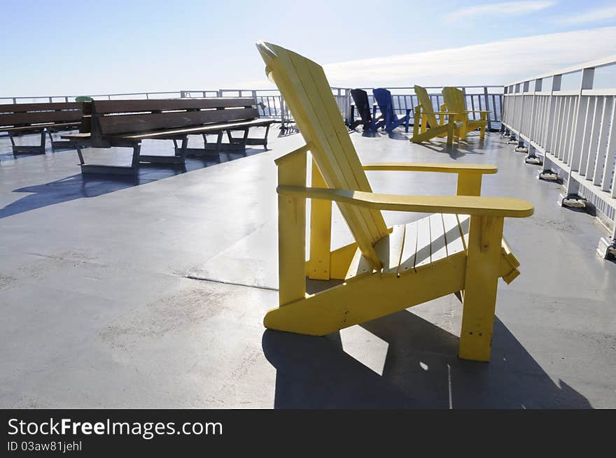 A yellow chair on a  cruise deck. A yellow chair on a  cruise deck.