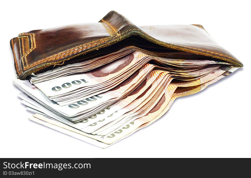 Wallet with money on a white background