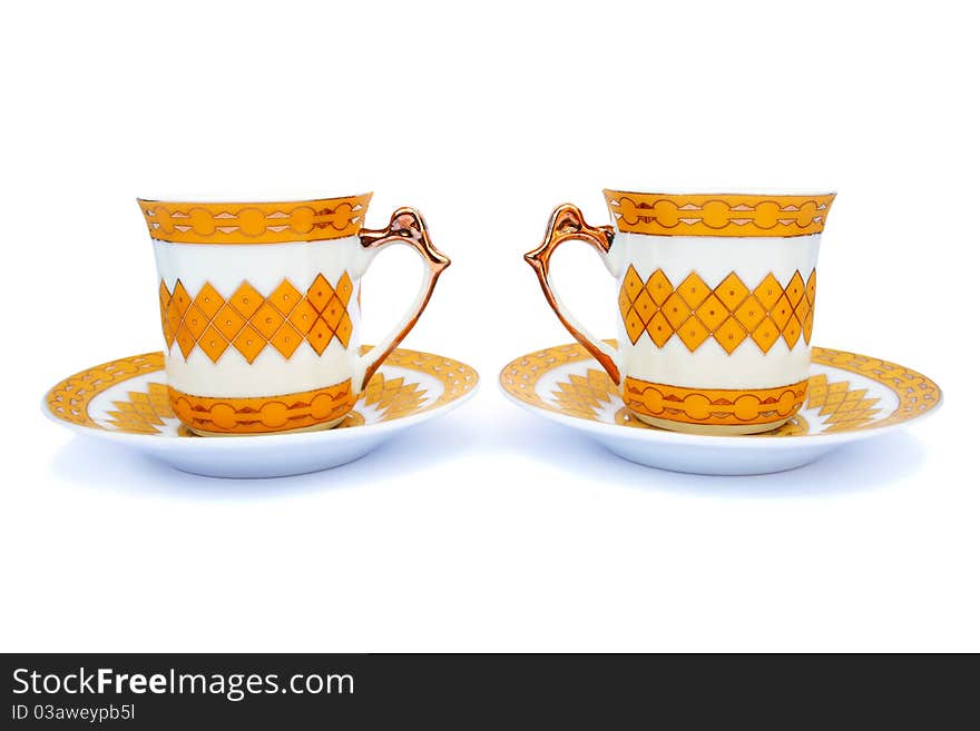 Cups with dishes isolated on white background.