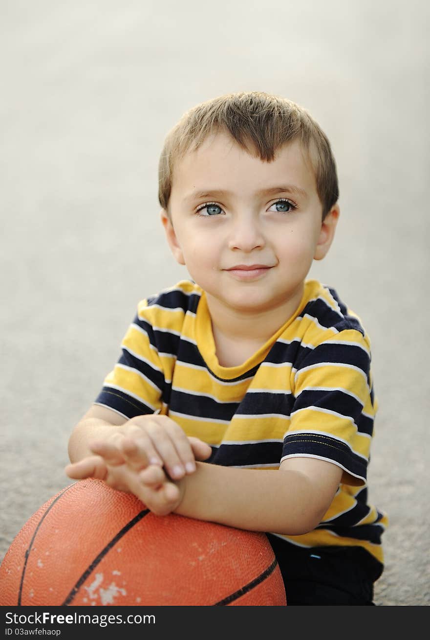 Adorable child holding  the basketball. Adorable child holding  the basketball