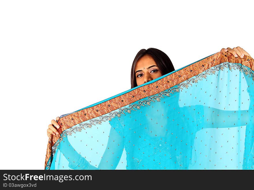 Young Indian girl in traditional clothing. Isolated on a white background.