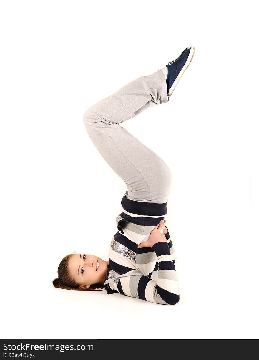 Beautiful young woman makes stretching isolated over white background