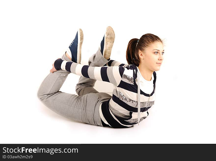 Beautiful young woman makes stretching isolated over white background