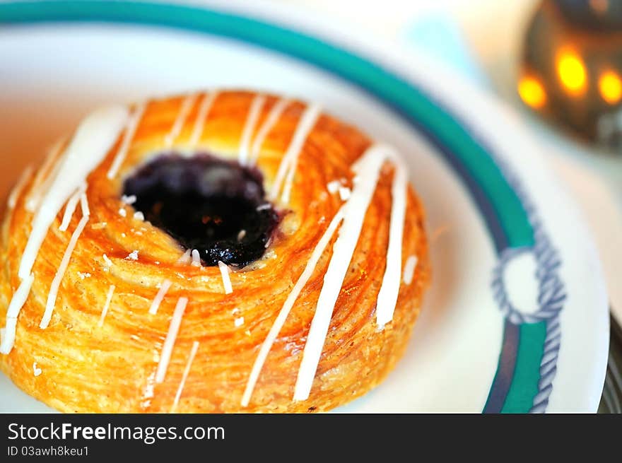 Freshly baked danish on white plate. Freshly baked danish on white plate.