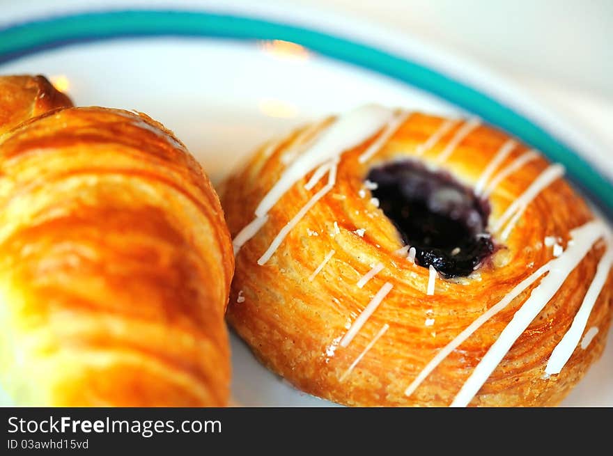 Tasty danish pastry on white plate for breakfast. Tasty danish pastry on white plate for breakfast.