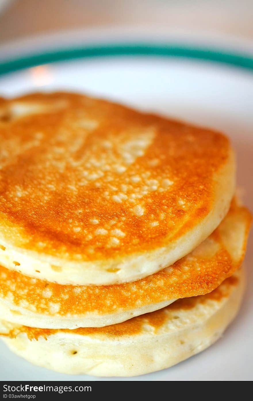 Freshly made golden brown pancakes. Freshly made golden brown pancakes.