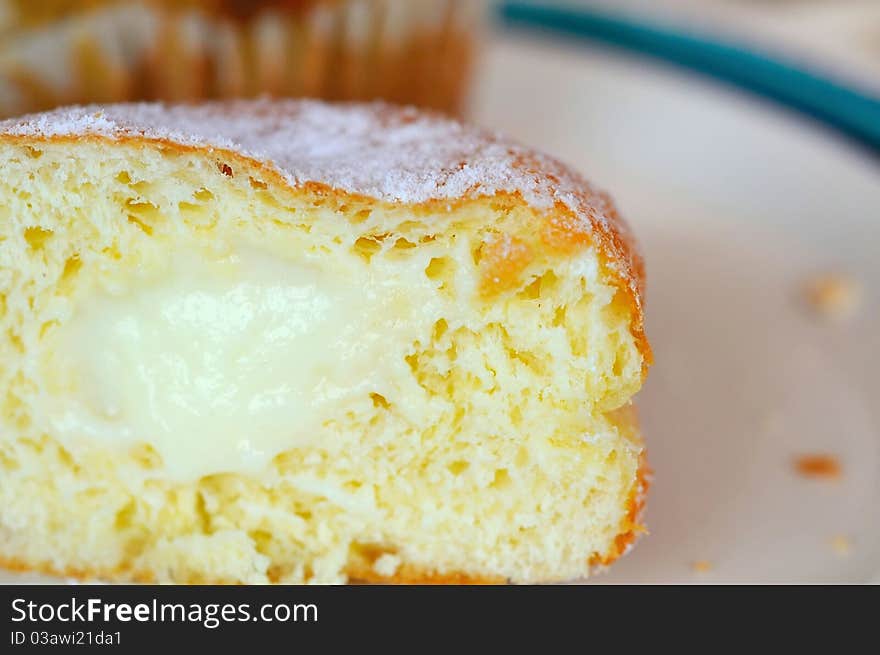 Cross section of freshly baked custard cream bread. Cross section of freshly baked custard cream bread.