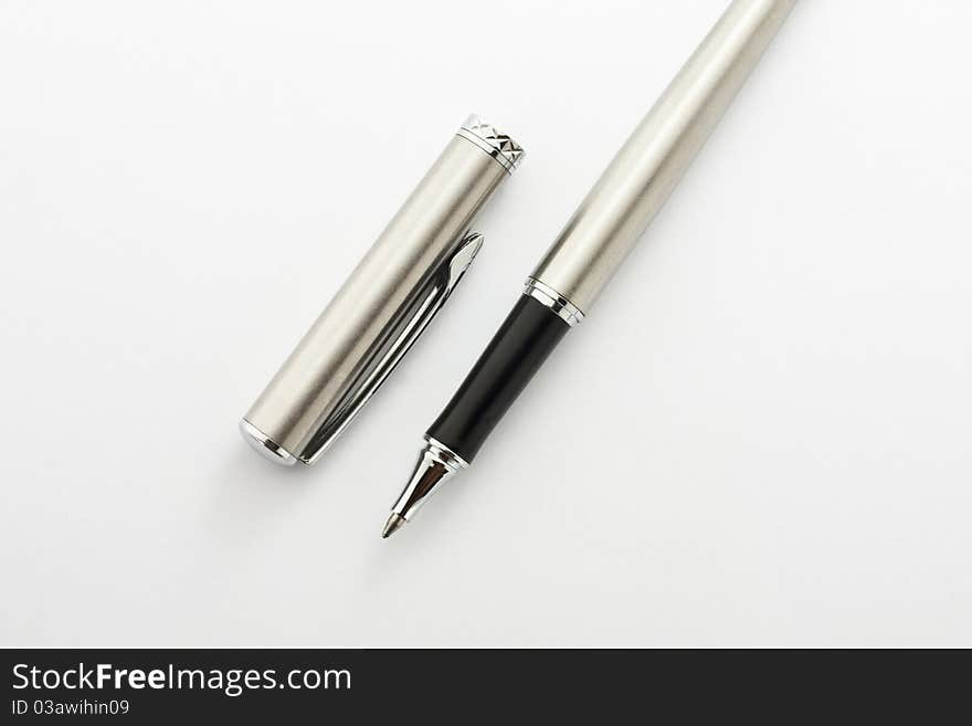 Pen and silver casing. Placed on a white background.