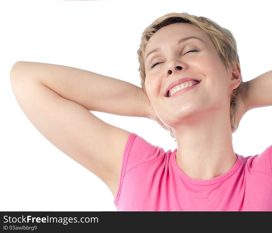 Beautiful short haired blonde woman relaxing and smiling with her hands behind her head. Isolated on white background. Beautiful short haired blonde woman relaxing and smiling with her hands behind her head. Isolated on white background