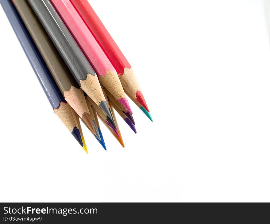 Some color pencils in a bunch on a white background. Some color pencils in a bunch on a white background