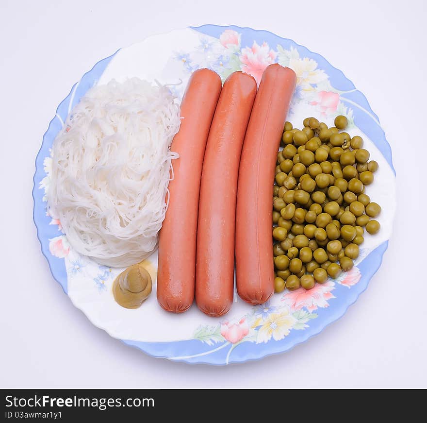 Dish with sausage, noodles and green peas. Dish with sausage, noodles and green peas