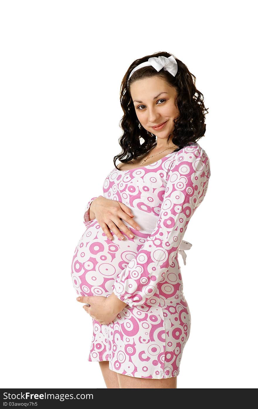 Woman expecting baby. Isolated over white