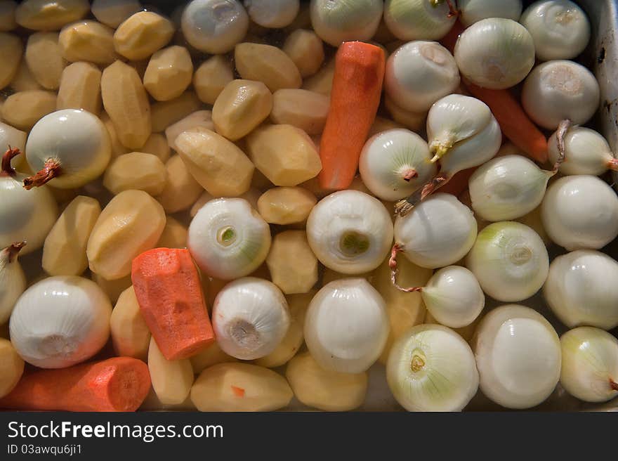 Cleared crude vegetables in water for dish preparation