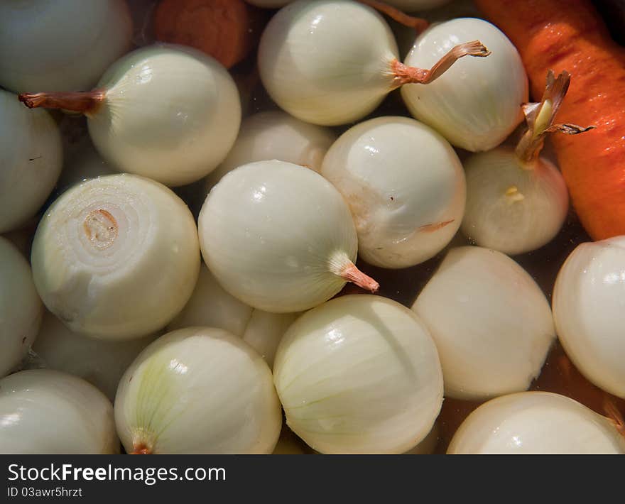 Cleared crude vegetables in water for dish preparation