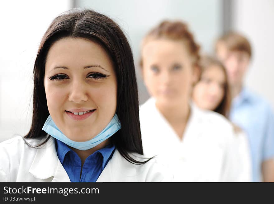 Inside the modern lab of university hospital, young confidental successful doctors and scientists