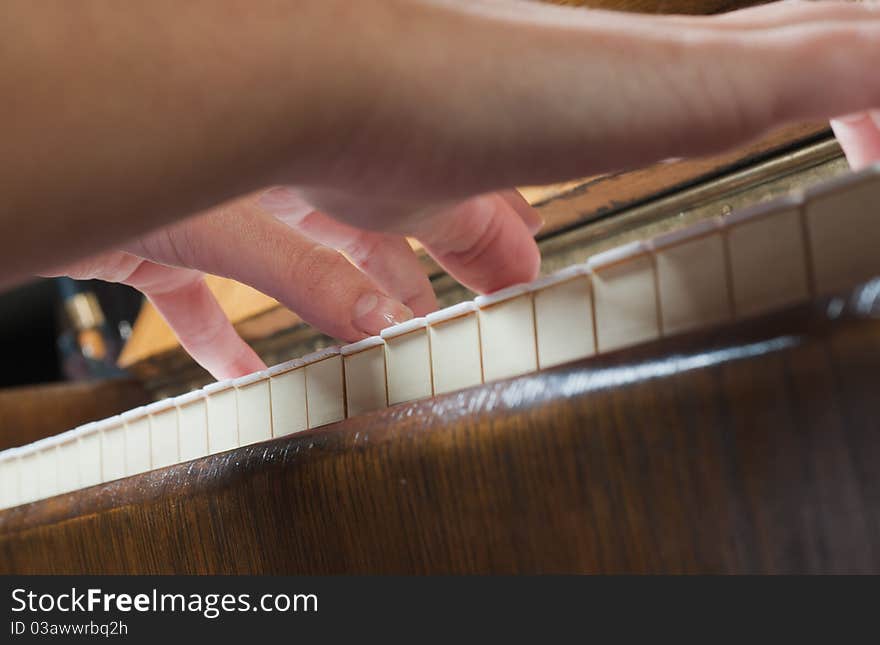 Female hand on a piano. Female hand on a piano