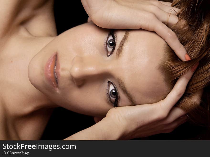 Close up of a beautiful girl on the bed making sensual poses. Close up of a beautiful girl on the bed making sensual poses.