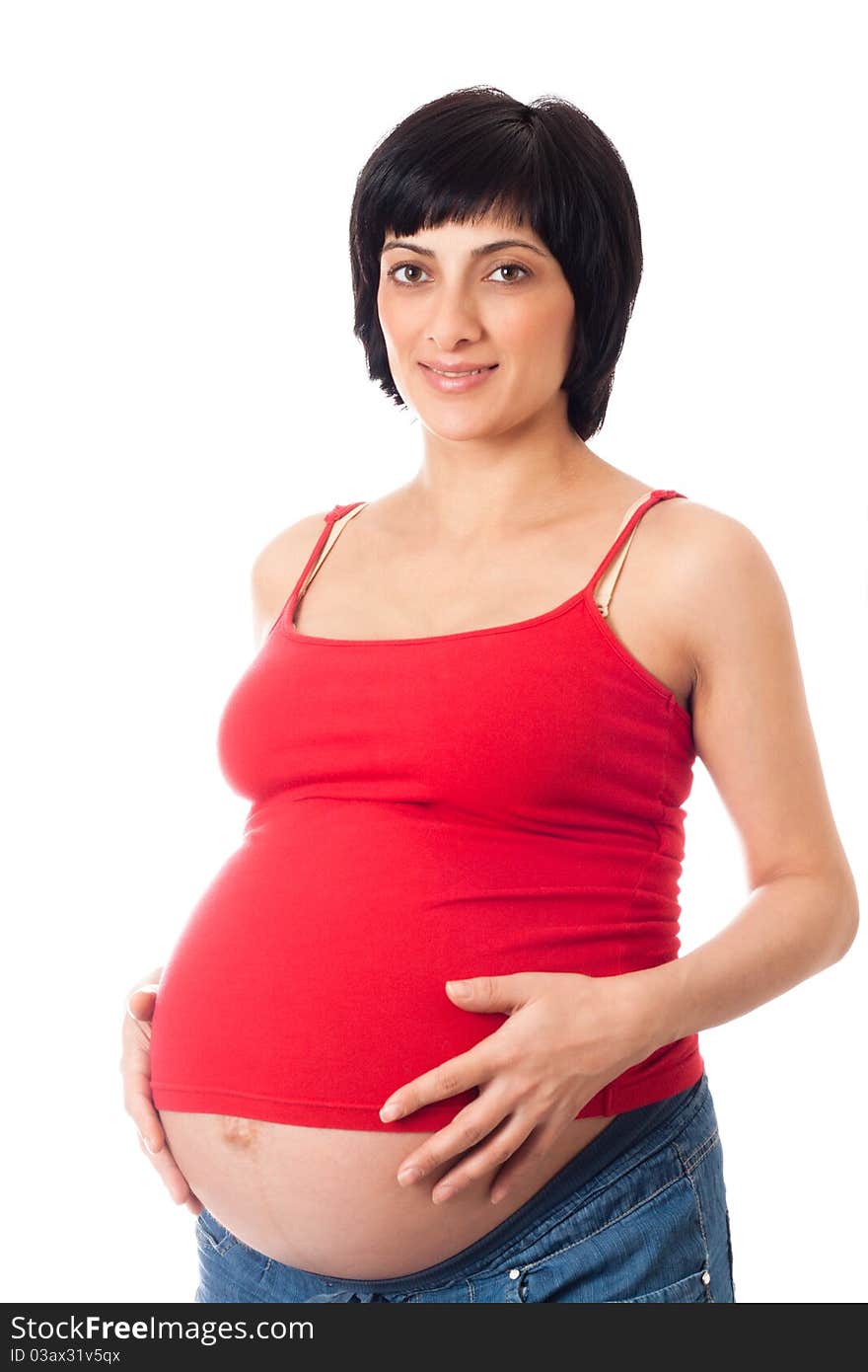 Smiling pregnant woman over white background