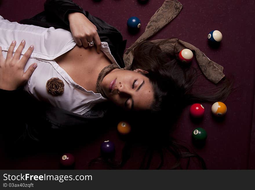 Detail view of a girl next to a snooker table. Detail view of a girl next to a snooker table.