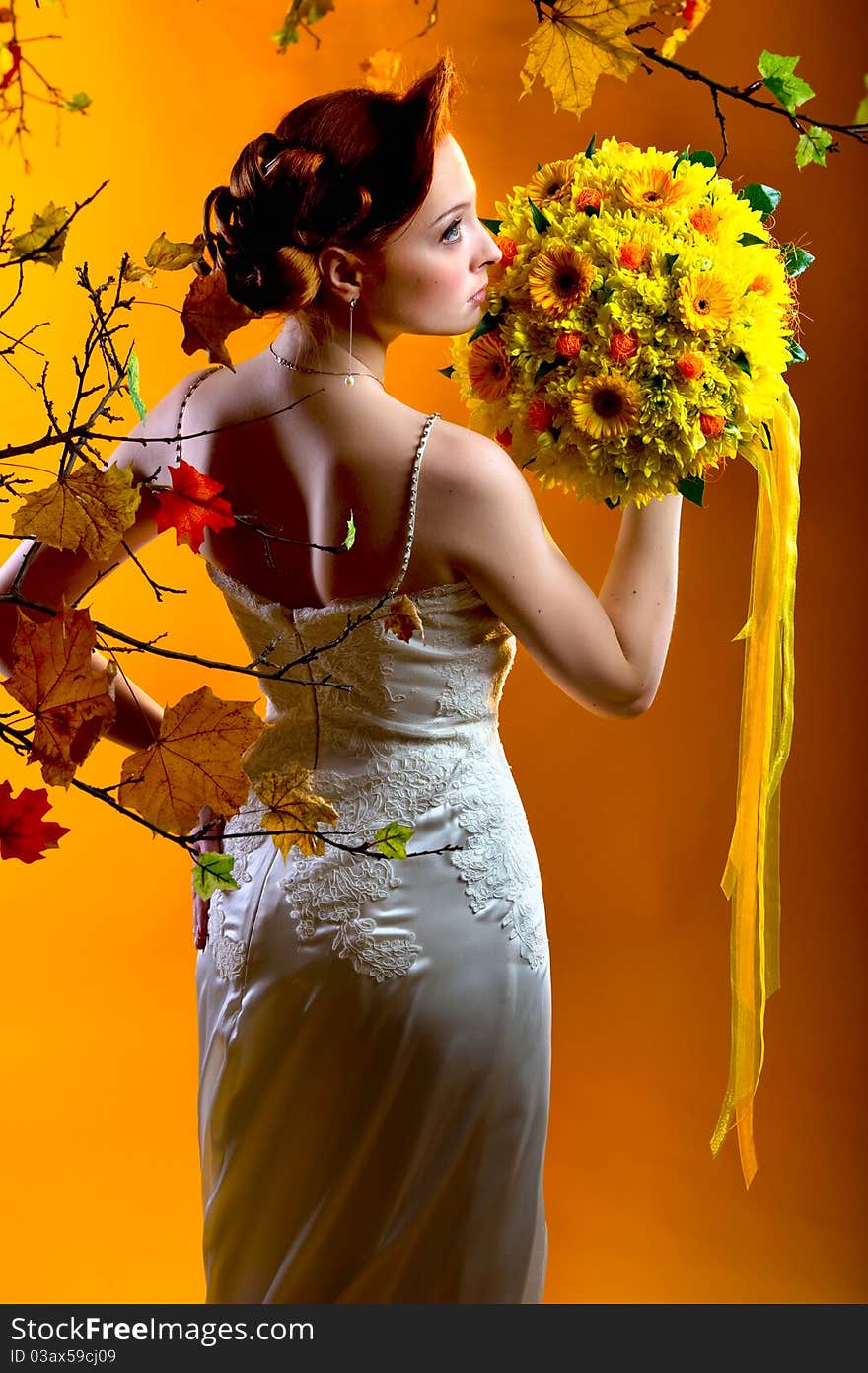 Gorgeous young redhead woman with bouquet of flowers. Gorgeous young redhead woman with bouquet of flowers