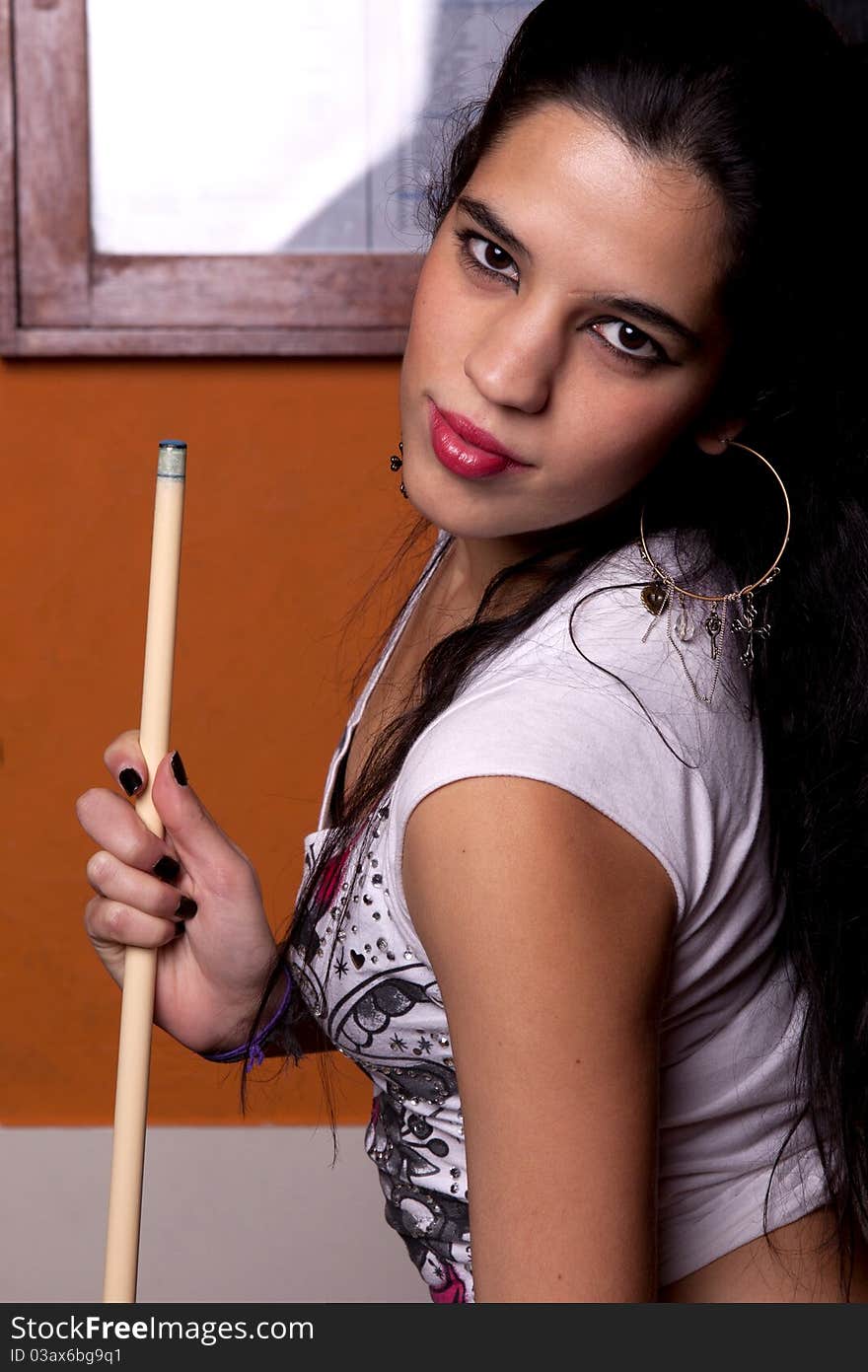 Detail view of a girl next to a snooker table. Detail view of a girl next to a snooker table.