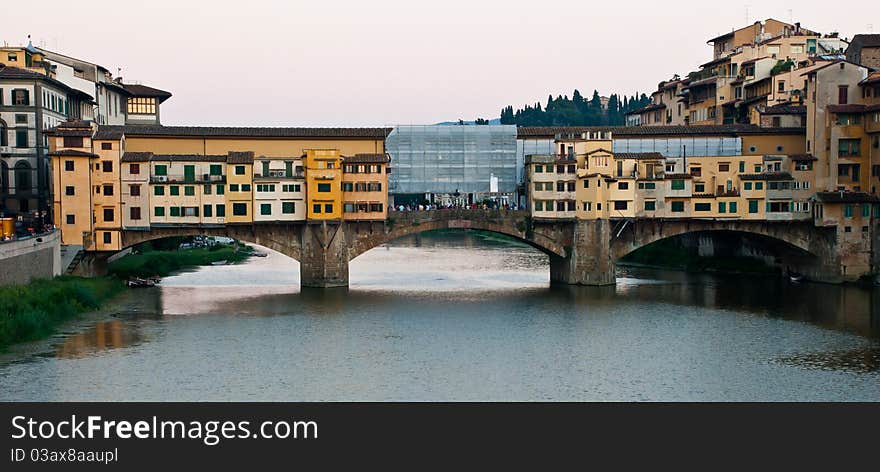 Ponte Vecchio by day. Stone bridge. River.