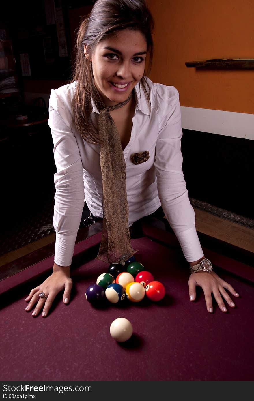 Detail view of a girl next to a snooker table. Detail view of a girl next to a snooker table.