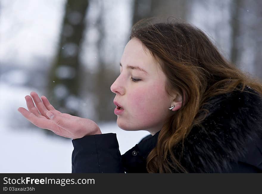 Young girl blowing kiss