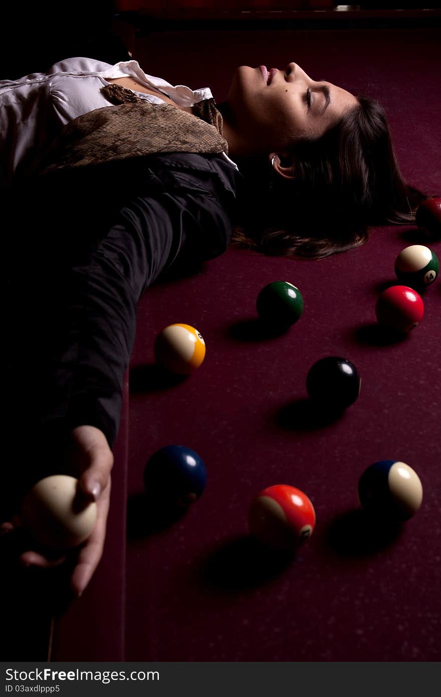 Detail view of a girl next to a snooker table. Detail view of a girl next to a snooker table.