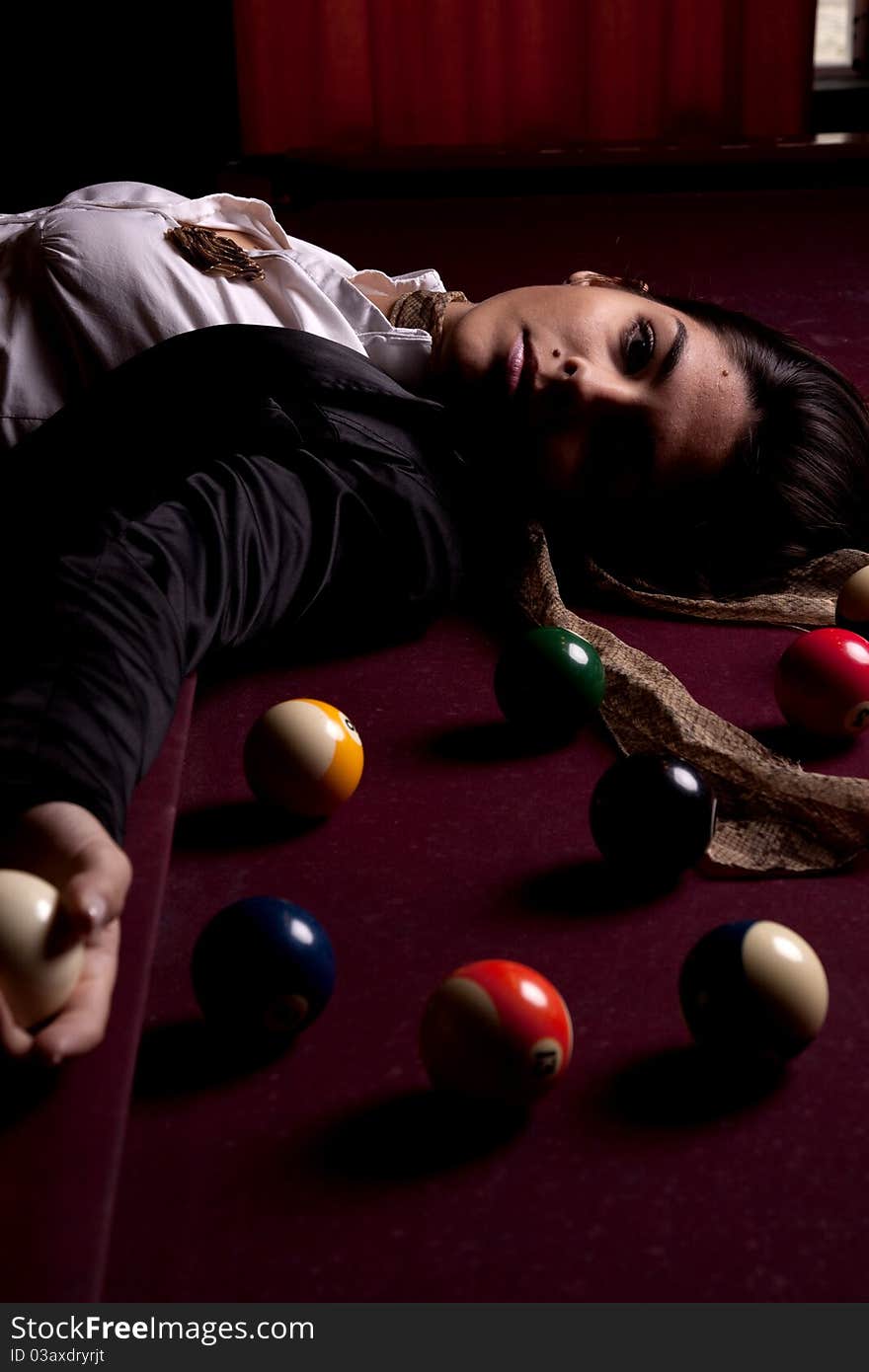 Detail view of a girl next to a snooker table. Detail view of a girl next to a snooker table.