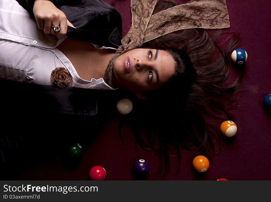 Detail view of a girl next to a snooker table. Detail view of a girl next to a snooker table.