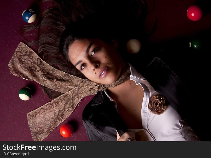 Detail view of a girl next to a snooker table. Detail view of a girl next to a snooker table.