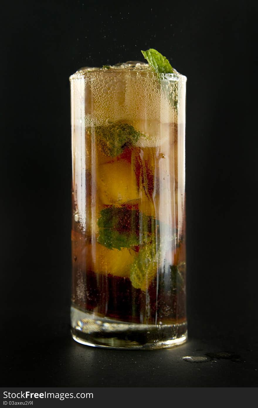 Glass with cola ice and mint.