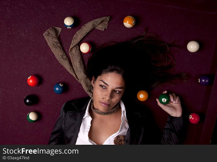 Detail view of a girl next to a snooker table. Detail view of a girl next to a snooker table.