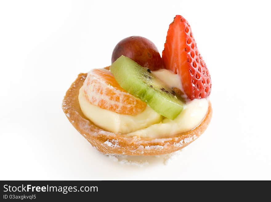 Small pie with cream and different fruits. Small pie with cream and different fruits