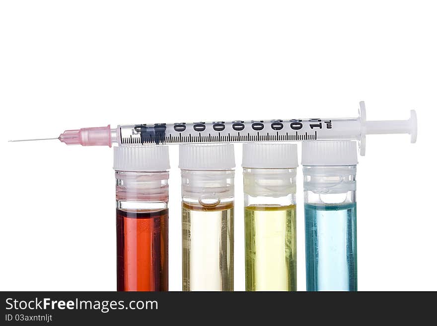 Syringe and test tubes on a white background. Syringe and test tubes on a white background.