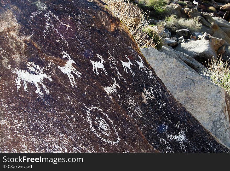 Written thousands of year ago these ancient petroglyphs can be found in Grapevine Valley, Arizona. Written thousands of year ago these ancient petroglyphs can be found in Grapevine Valley, Arizona.